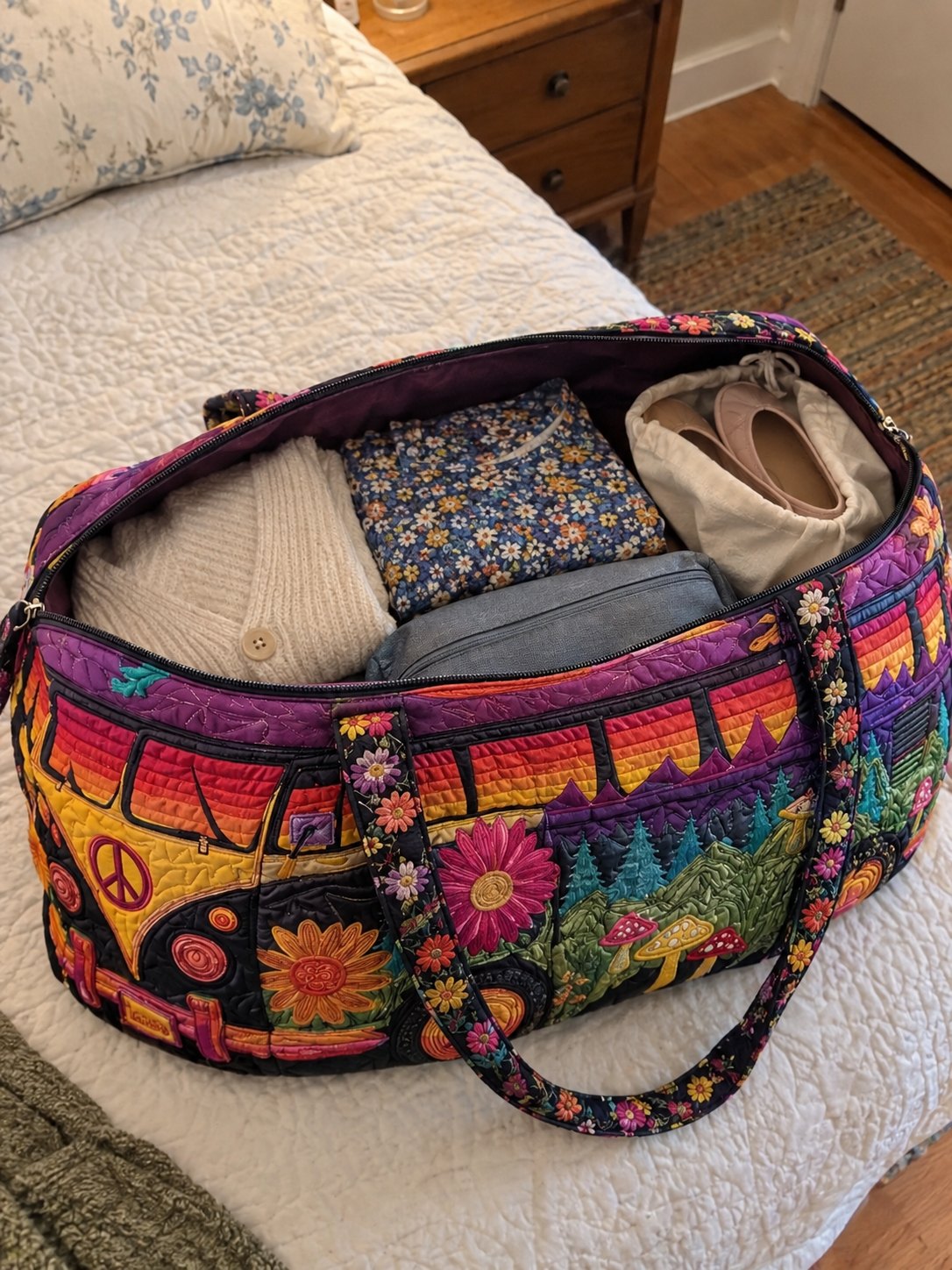 The duffle packed open on the bed